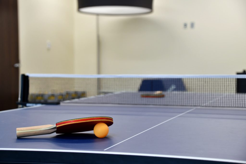 ping pong paddle and ball on a ping pong table cl 2023 11 27 05 29 11 utc